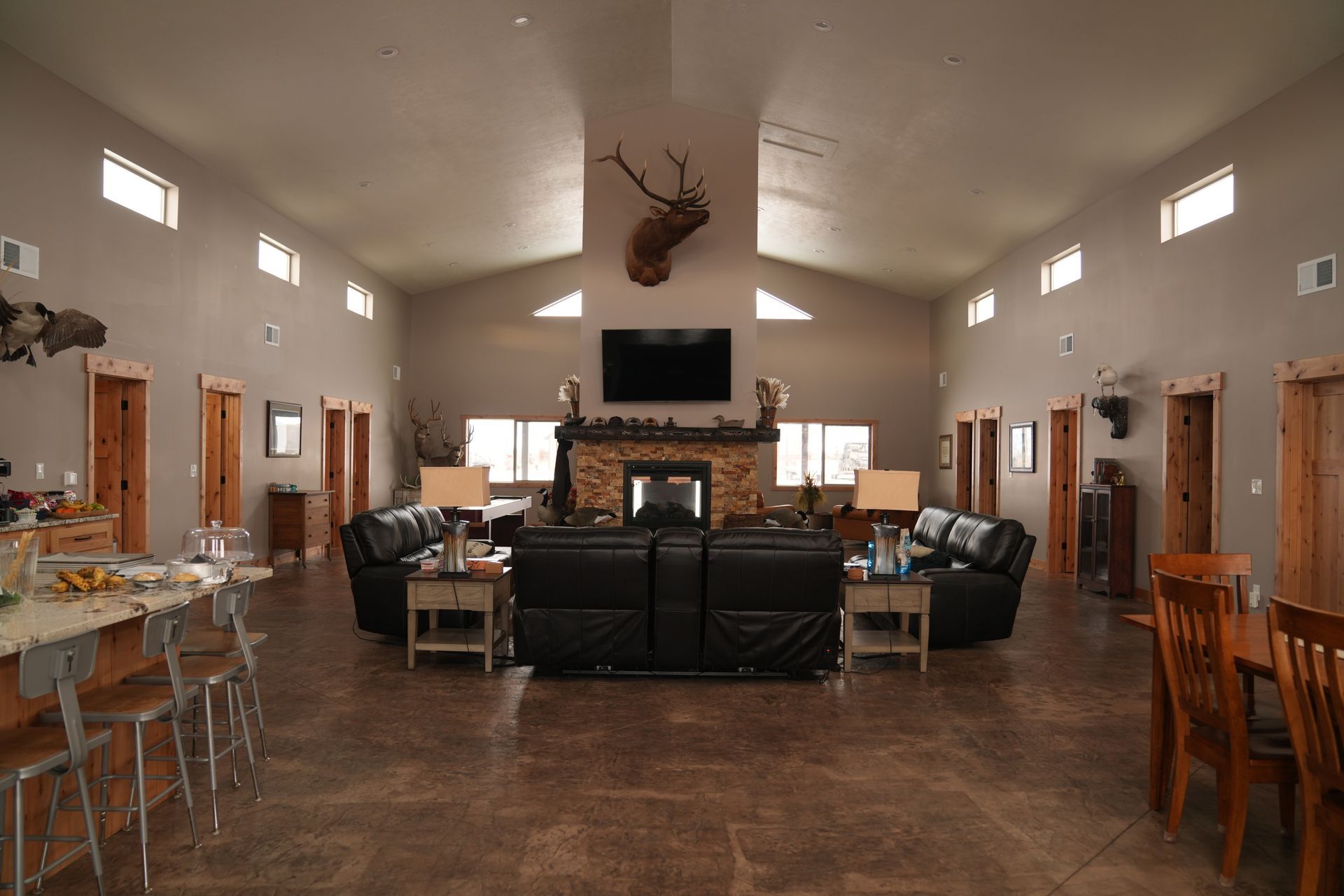 A large living room filled with furniture and a fireplace.