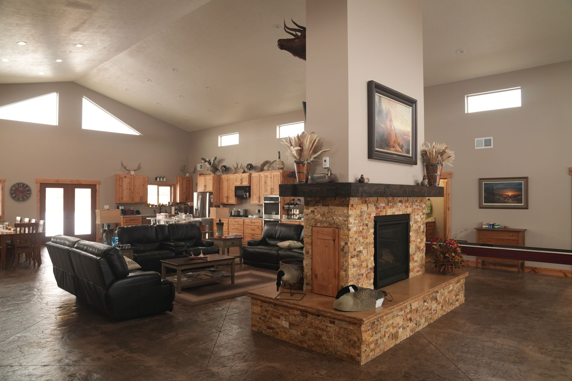 There is a fireplace in the middle of the living room.