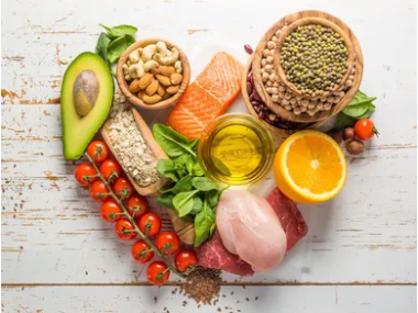 A heart shaped table topped with a variety of healthy foods.