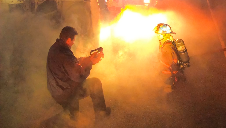 Jeff shooting video in smoke with firefighter