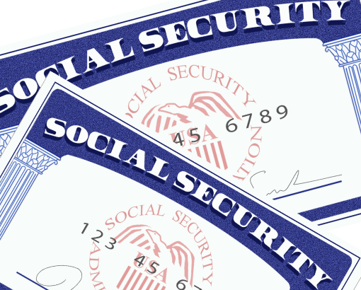 Two social security cards are stacked on top of each other