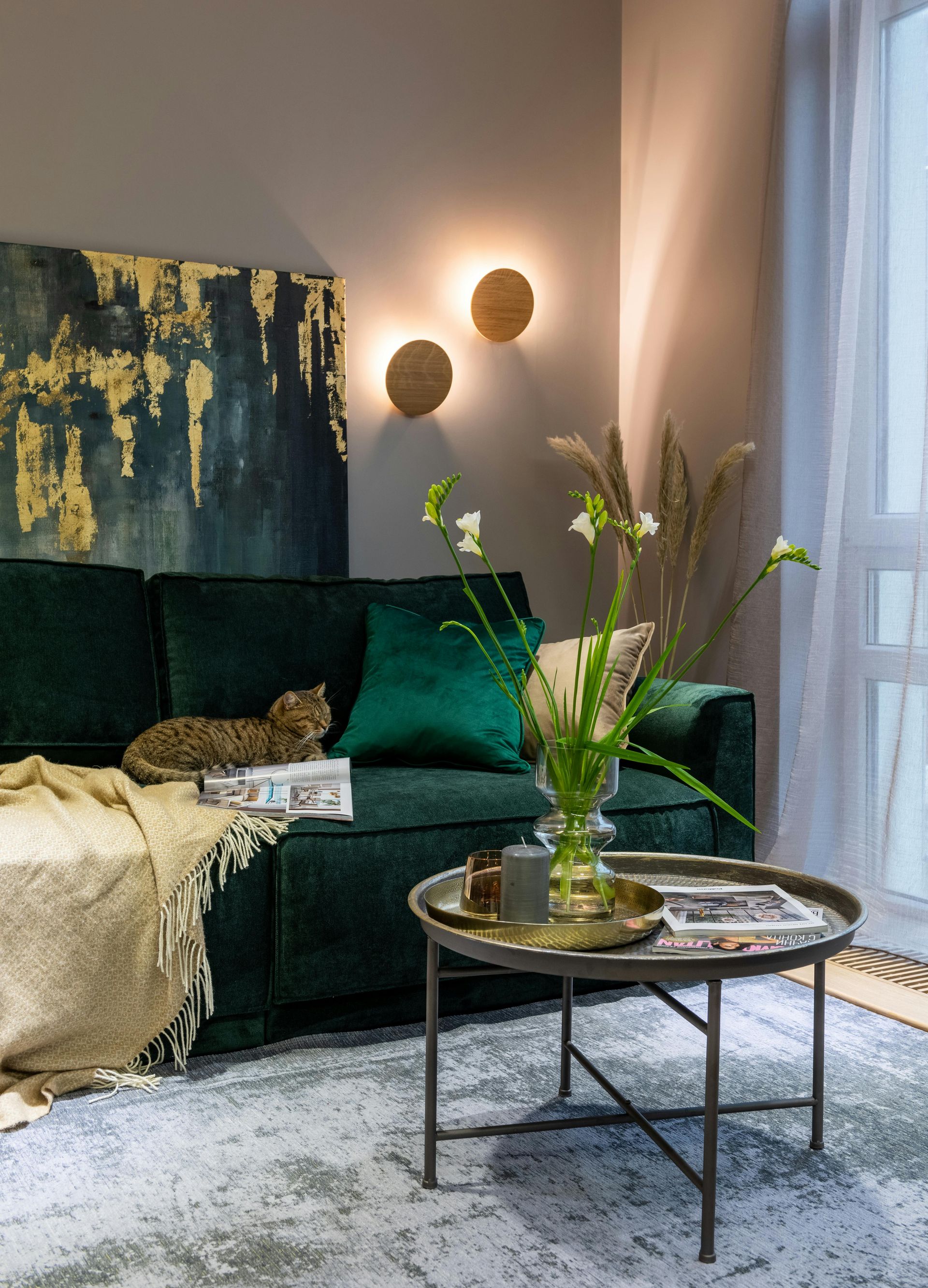 A living room with a green couch and a coffee table.