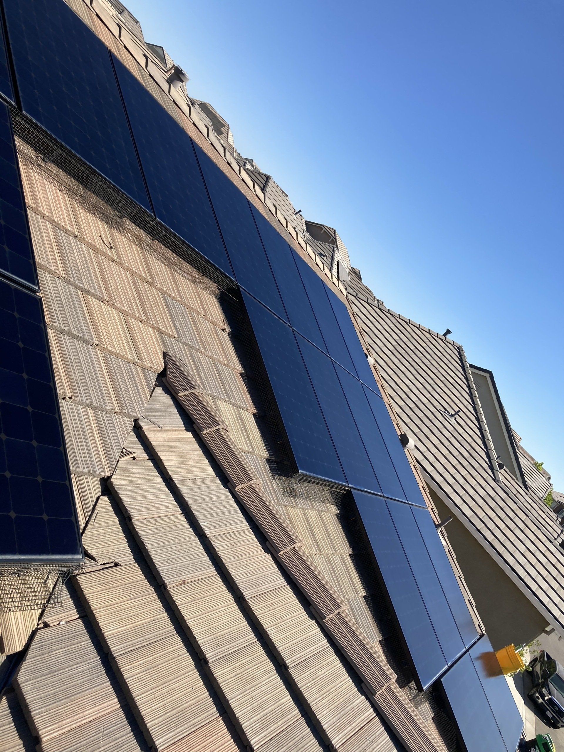 A roof with a lot of solar panels on it