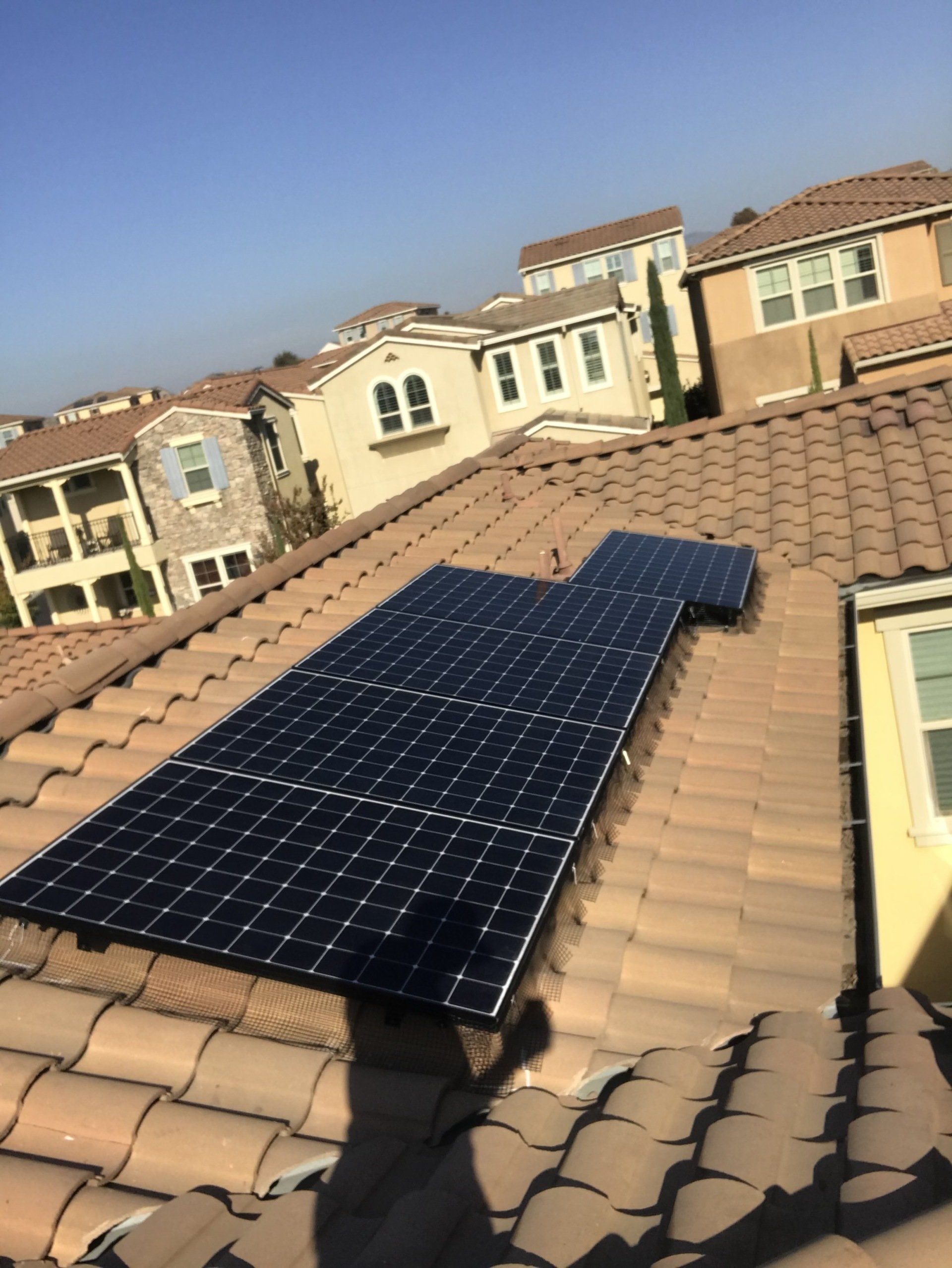 A roof with a lot of solar panels on it