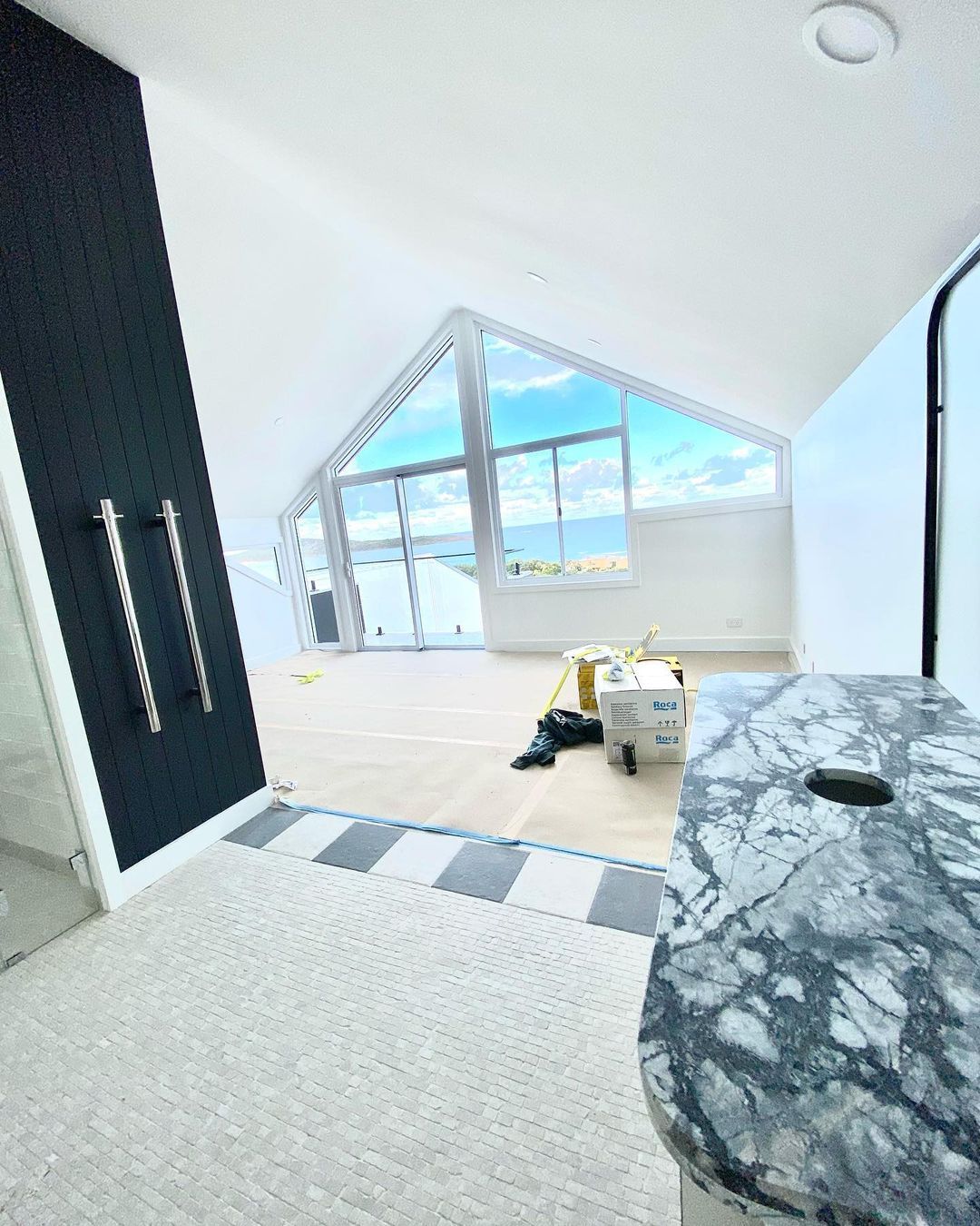 A room with a lot of windows and a marble counter top — MC Plastering In Fingal Bay, NSW