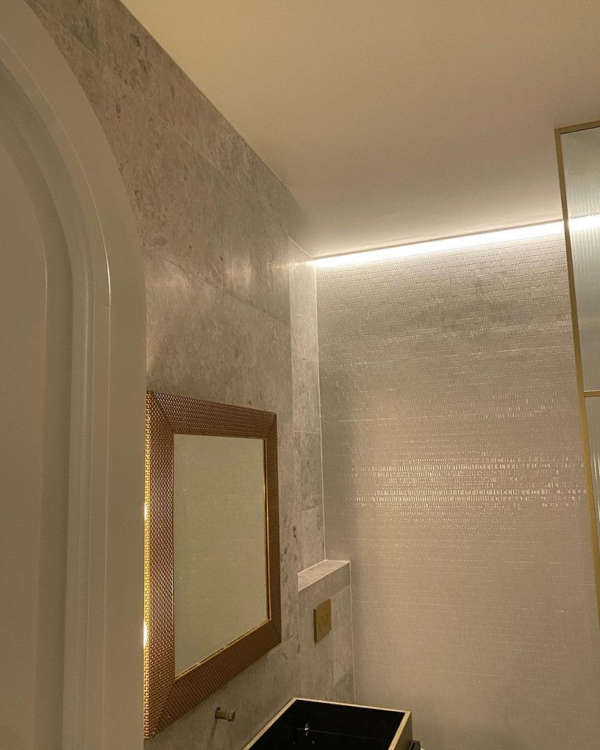 A Bathroom With A Sink, Mirror, And Ceiling Light — MC Plastering In Fingal Bay, NSW