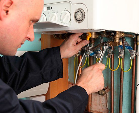 Plumber Installing Heater — Yorktown, VA — Dave's Plumbing Inc.