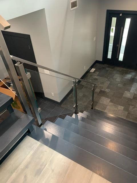 Commercial Glass Panels Beneath Metal Railing