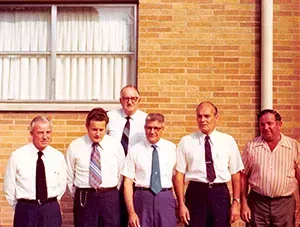 Several staff members in front of brick building Mynatt Funeral Home, Inc.