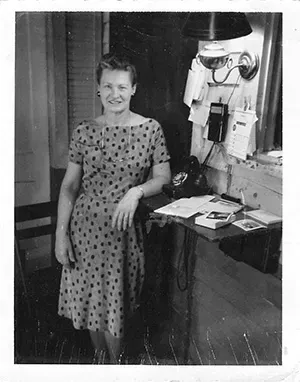 Black and white photo staff woman wearing polka dot dress Mynatt Funeral Home, Inc.