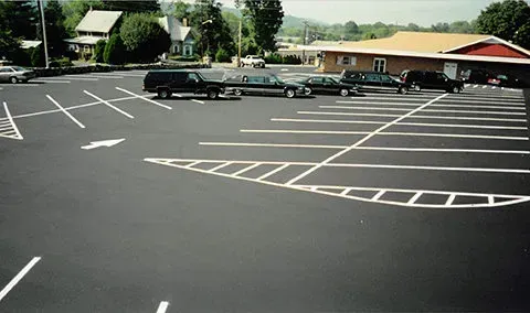 Fleet of hearses in parking lot at Mynatt Funeral Home, Inc.
