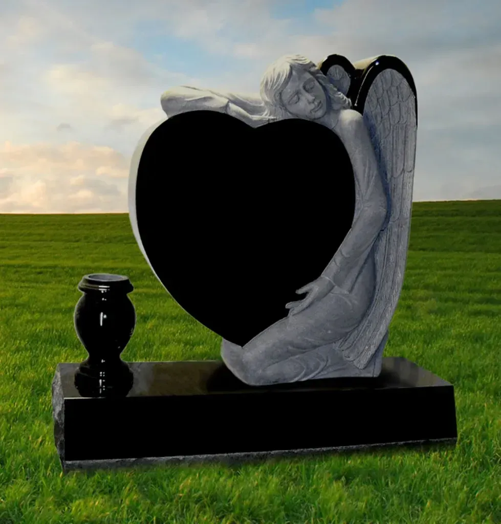 Granite and marble angel statue with floral vase monument offered by Mynatt Funeral Home, Inc.