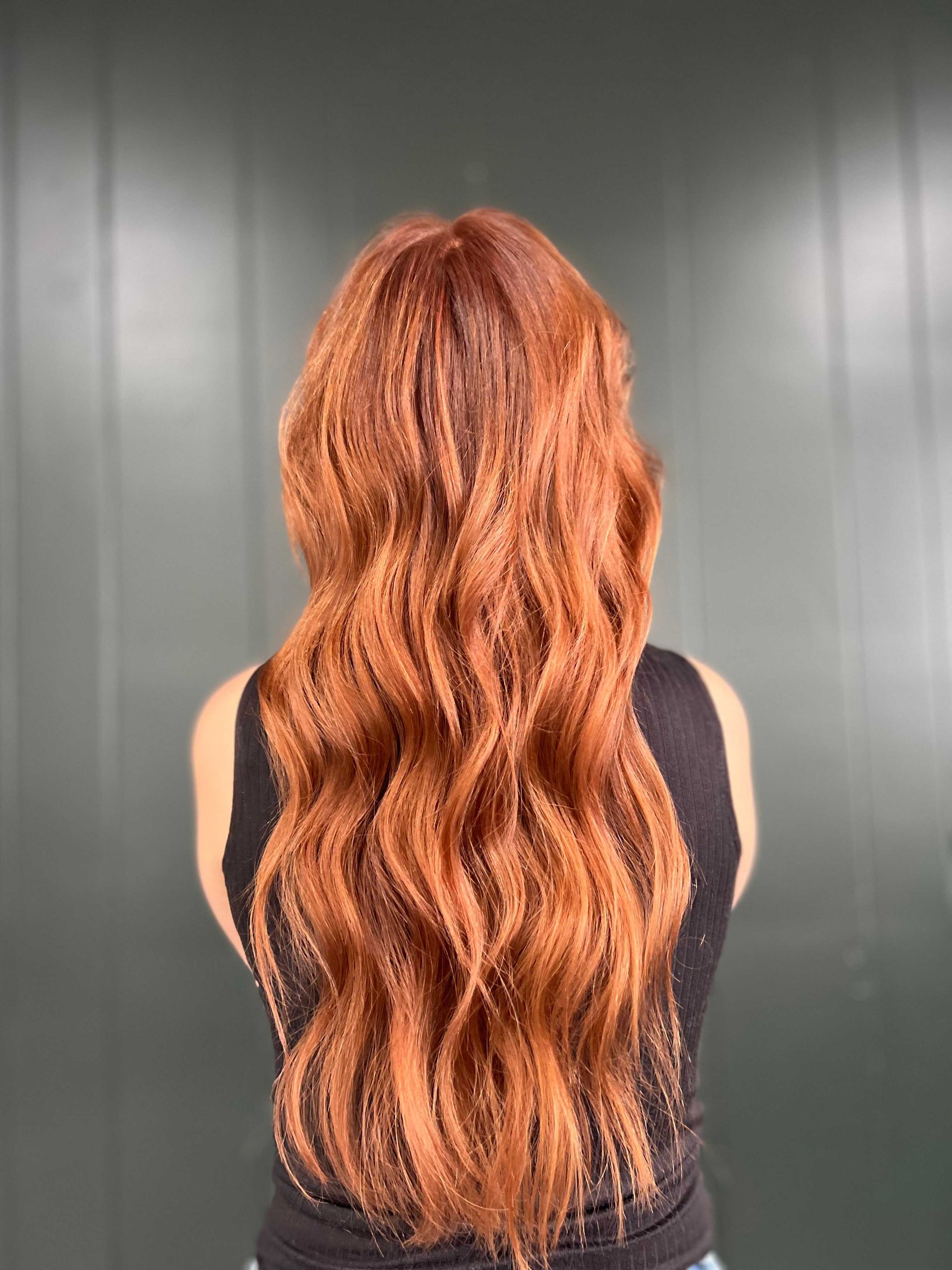 back of woman with custom color red hair Boone NC haircut