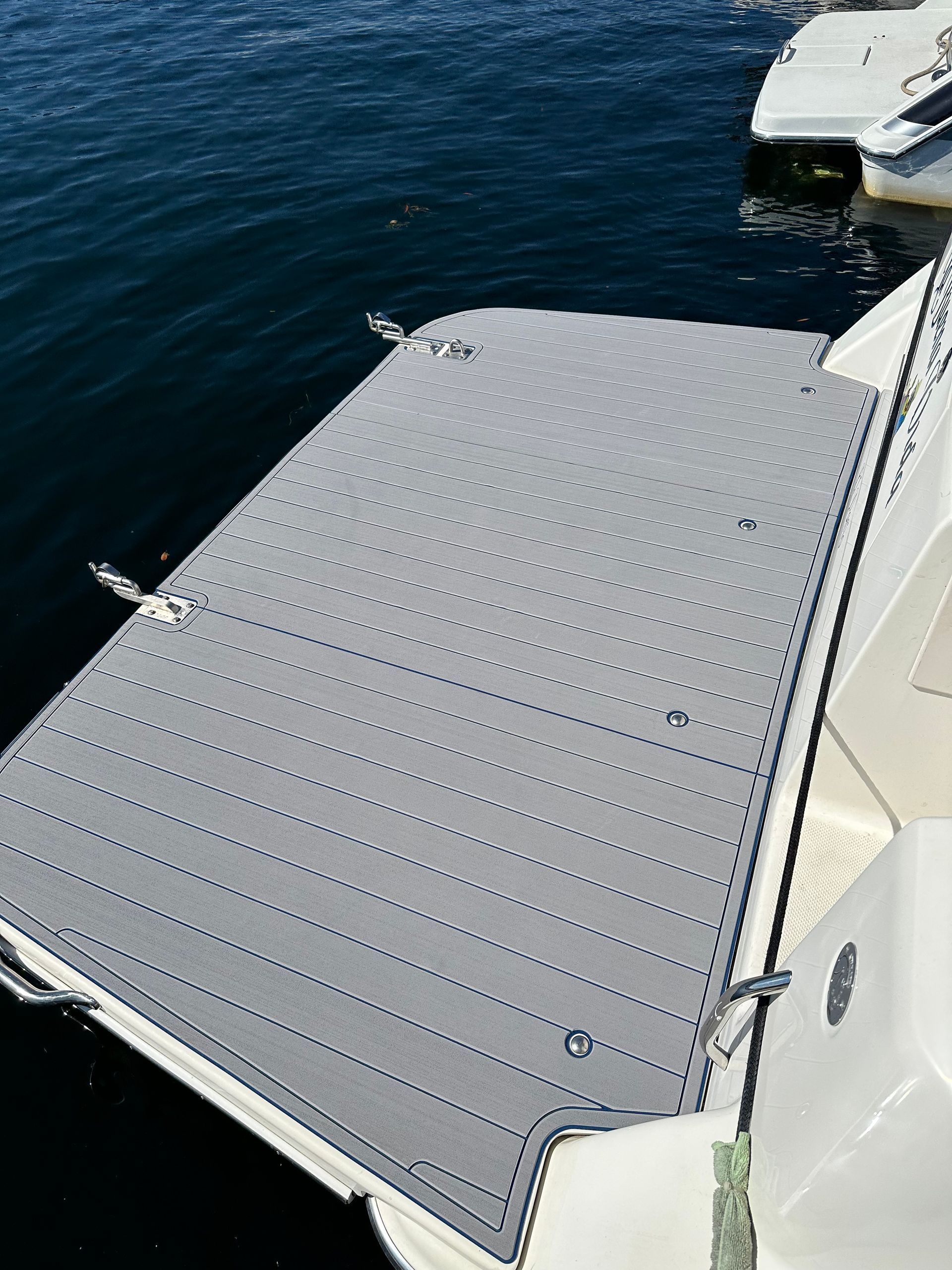 A boat with a dock attached to it in the water