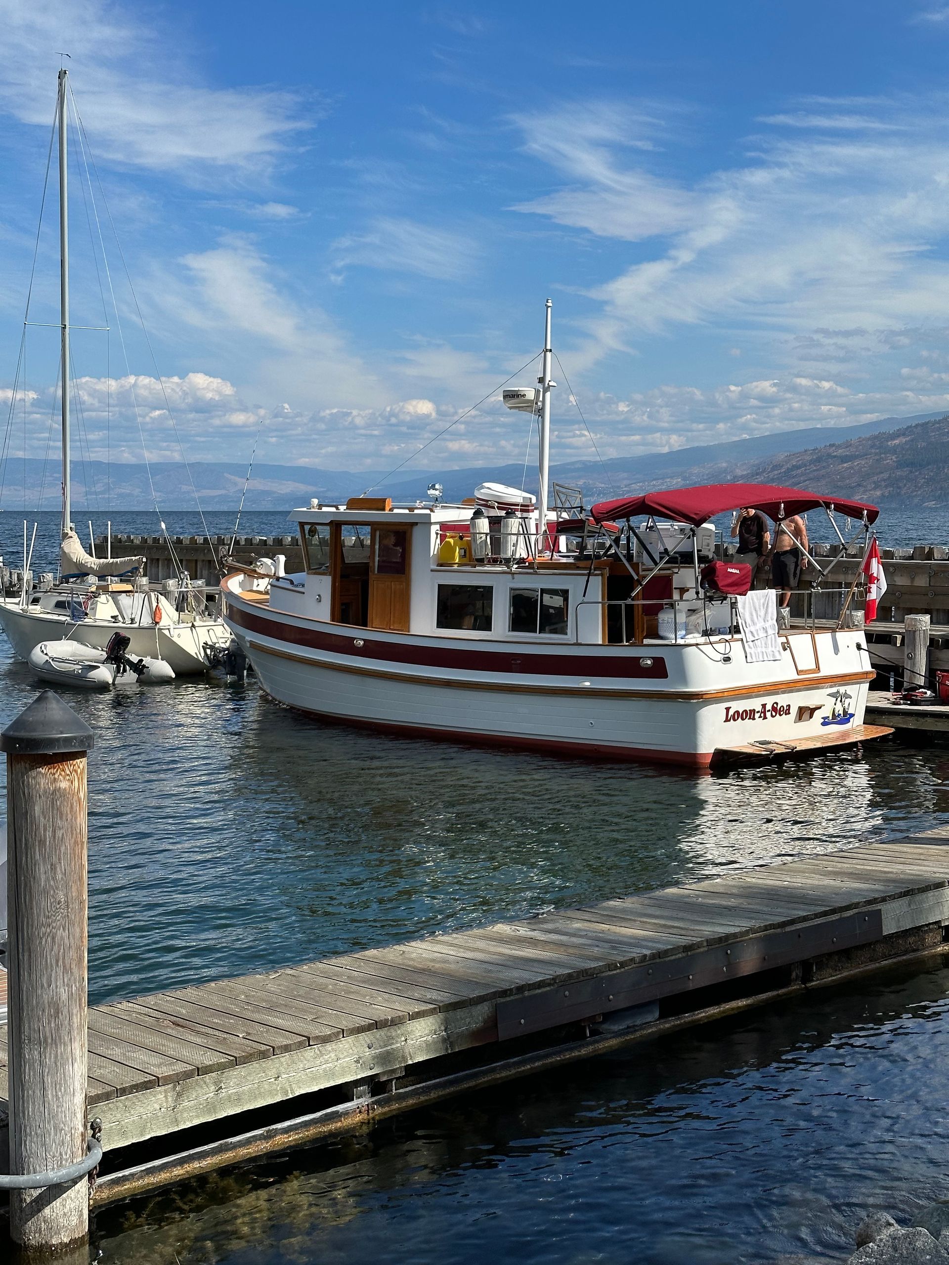 A boat is docked at a dock in the water.