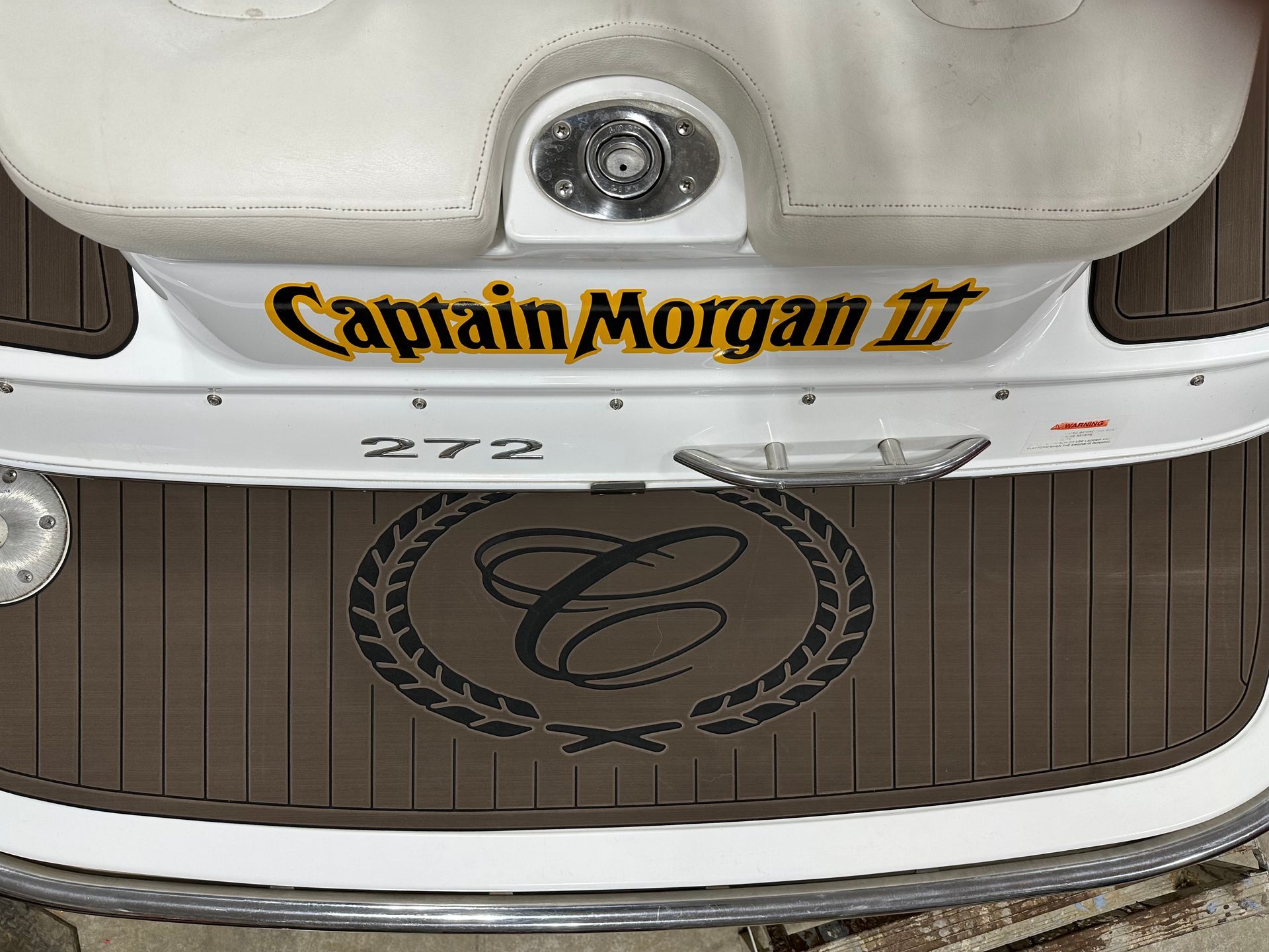 The name captain morgan is on the back of a boat