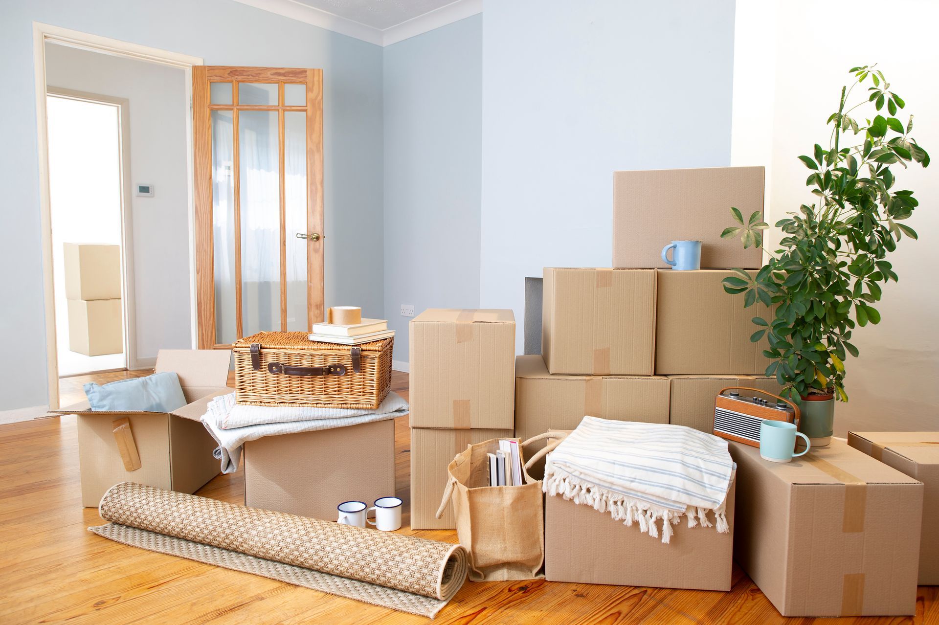 Boxes and household items packed with plastic-free boxes and paper tape for an eco-friendly move. Boxes and household items packed with plastic-free boxes and paper tape for an eco-friendly move.