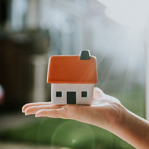 Hand Holding House Model — Helena, MT — Helena Abstract & Title Co