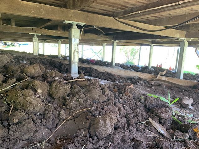There is a lot of dirt underneath a house.