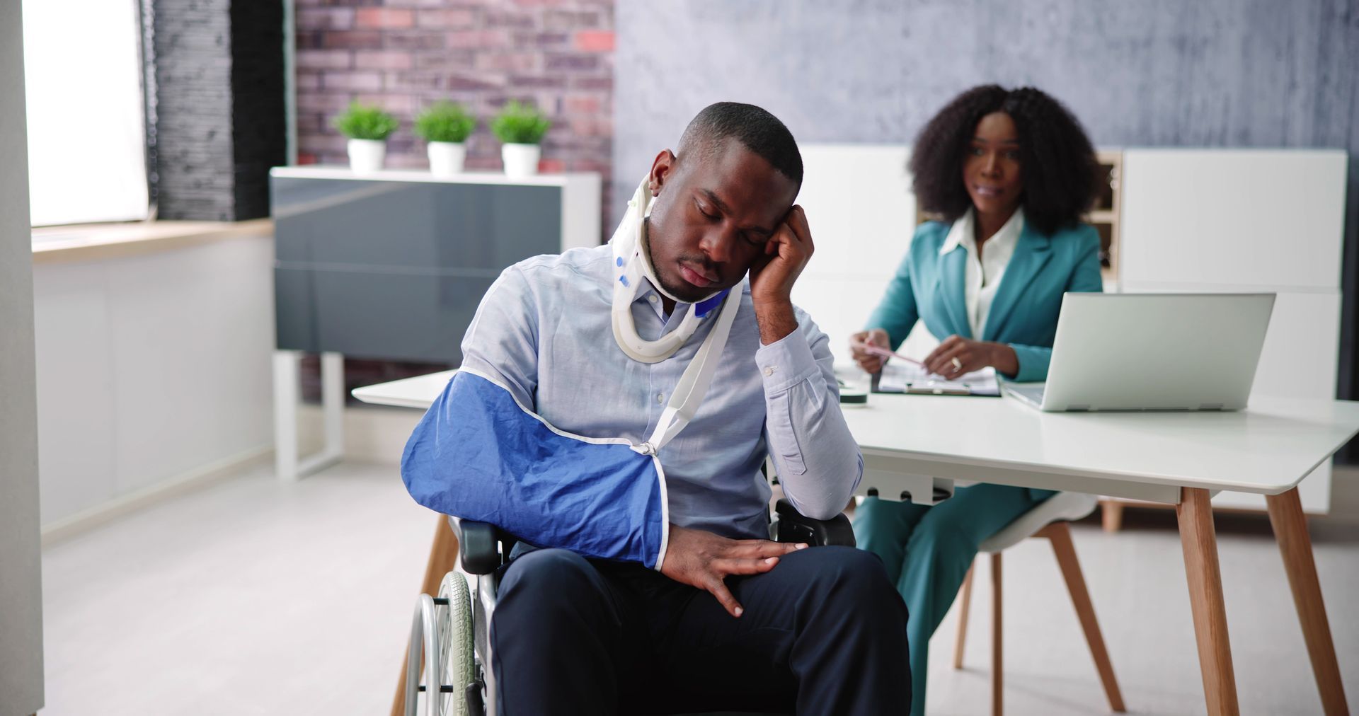 A lawyer is helping a man with a social security claim. A lawyer is helping a man with a social security claim.