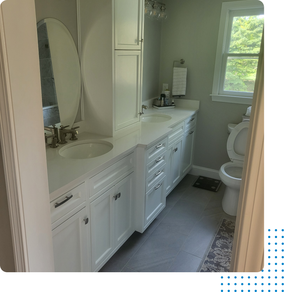A bathroom with a sink , toilet and mirror