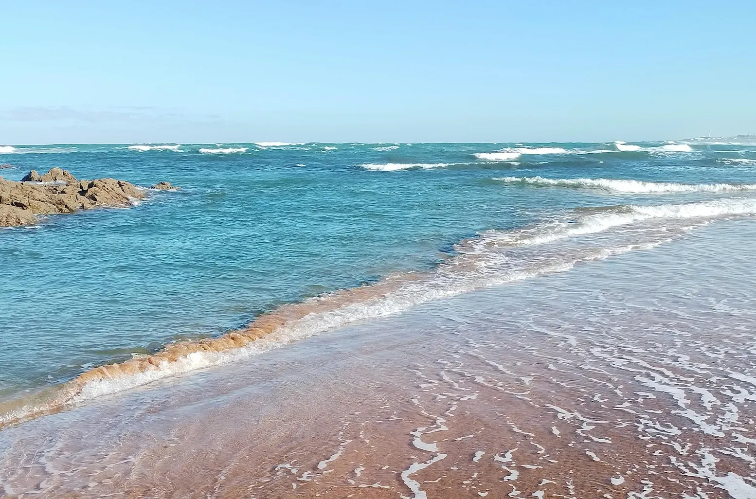 Northern beach with the tide partially in