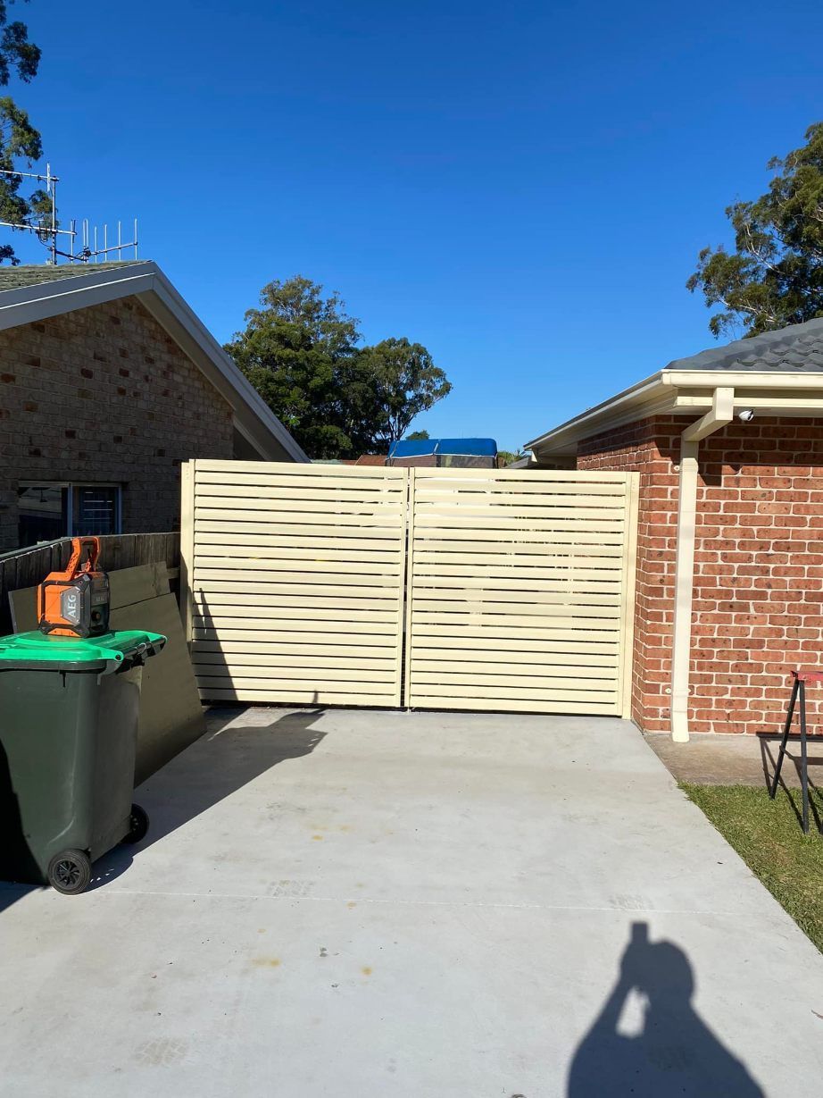 A Brick House With A White Fence — Arecta Fence In Lakewood, NSW