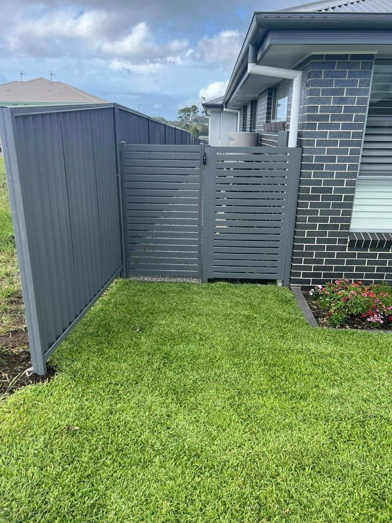A House With A Fence And A Gate In Front Of It — Arecta Fence In Lakewood, NSW