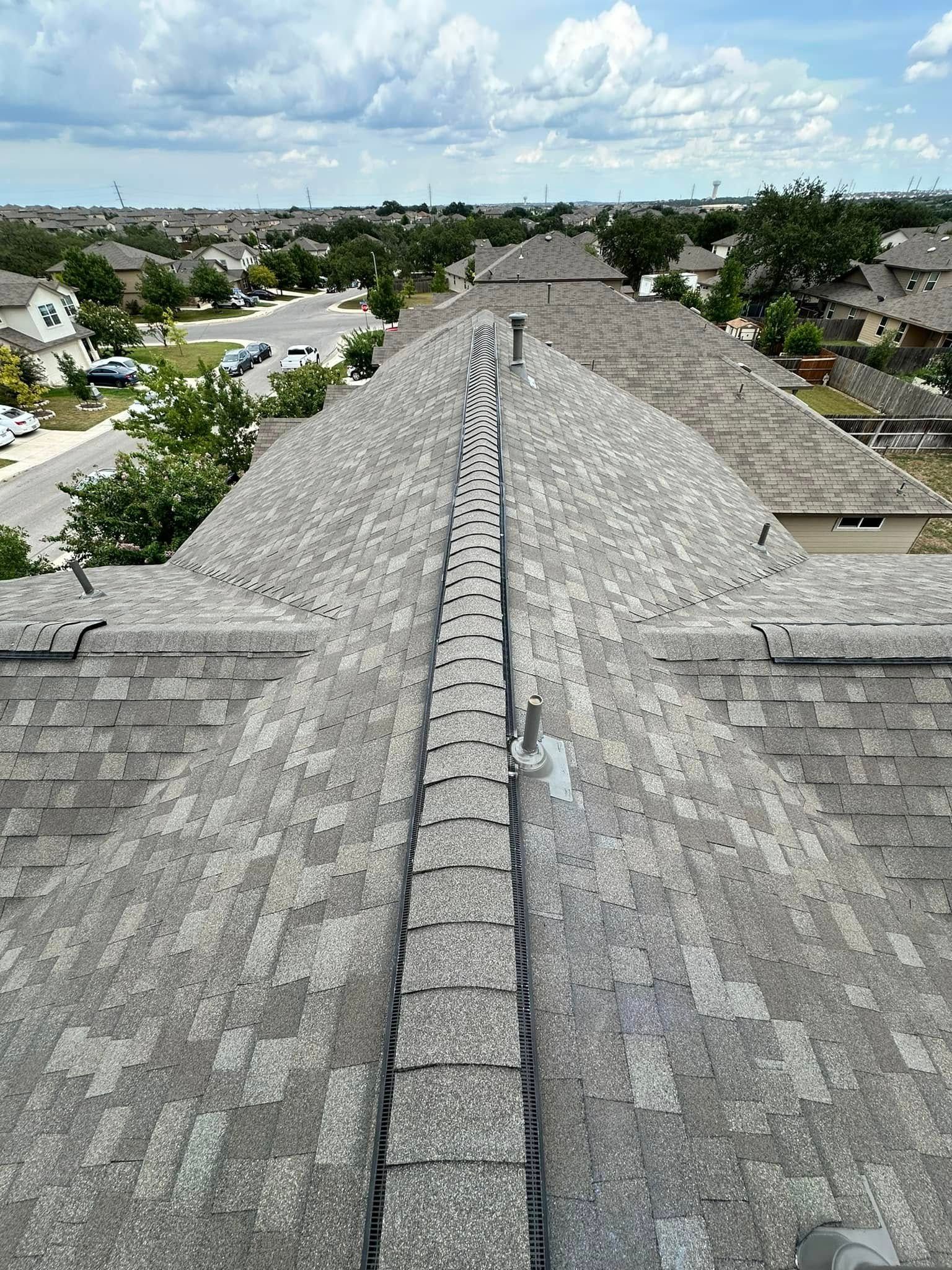 An aerial view of a roof with a drain on it.