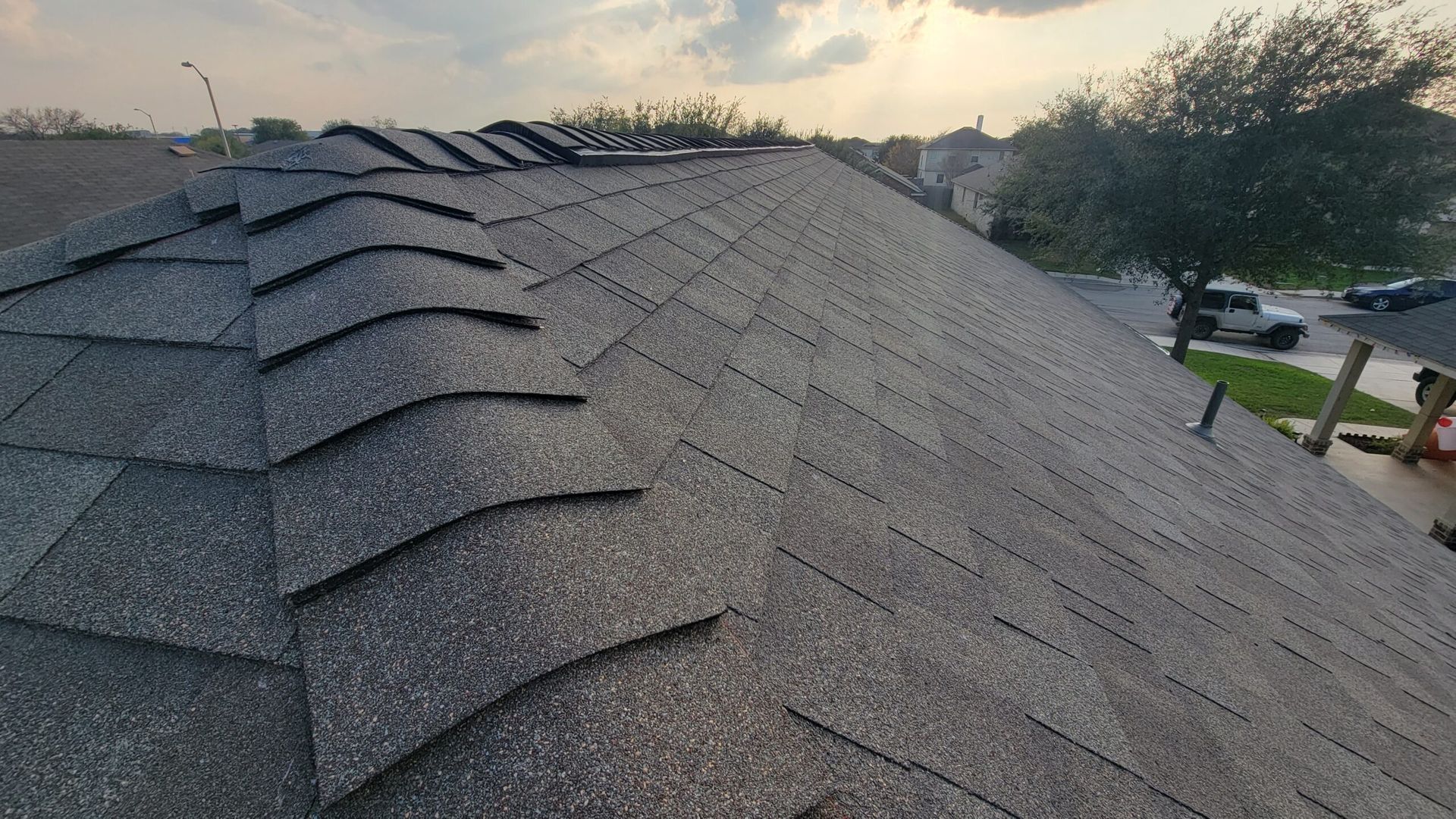 A close up of a roof with shingles on it.