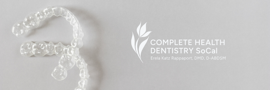 Clear aligners next to a dentist logo for Complete Health Dentistry SoCal.