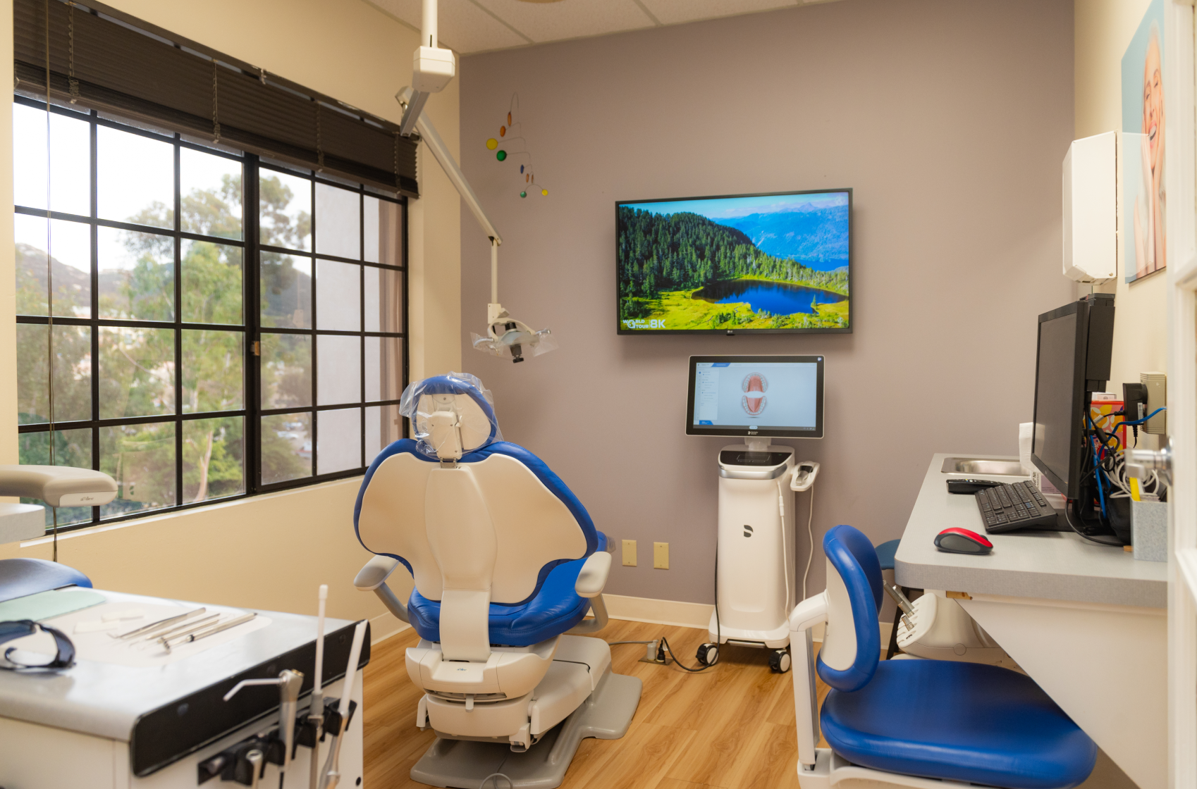 A man and a boy are brushing their teeth together in a bathroom.