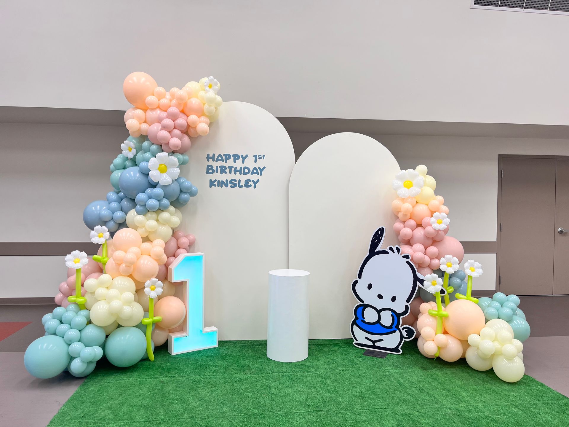 a construction themed birthday party with balloons and a brick wall