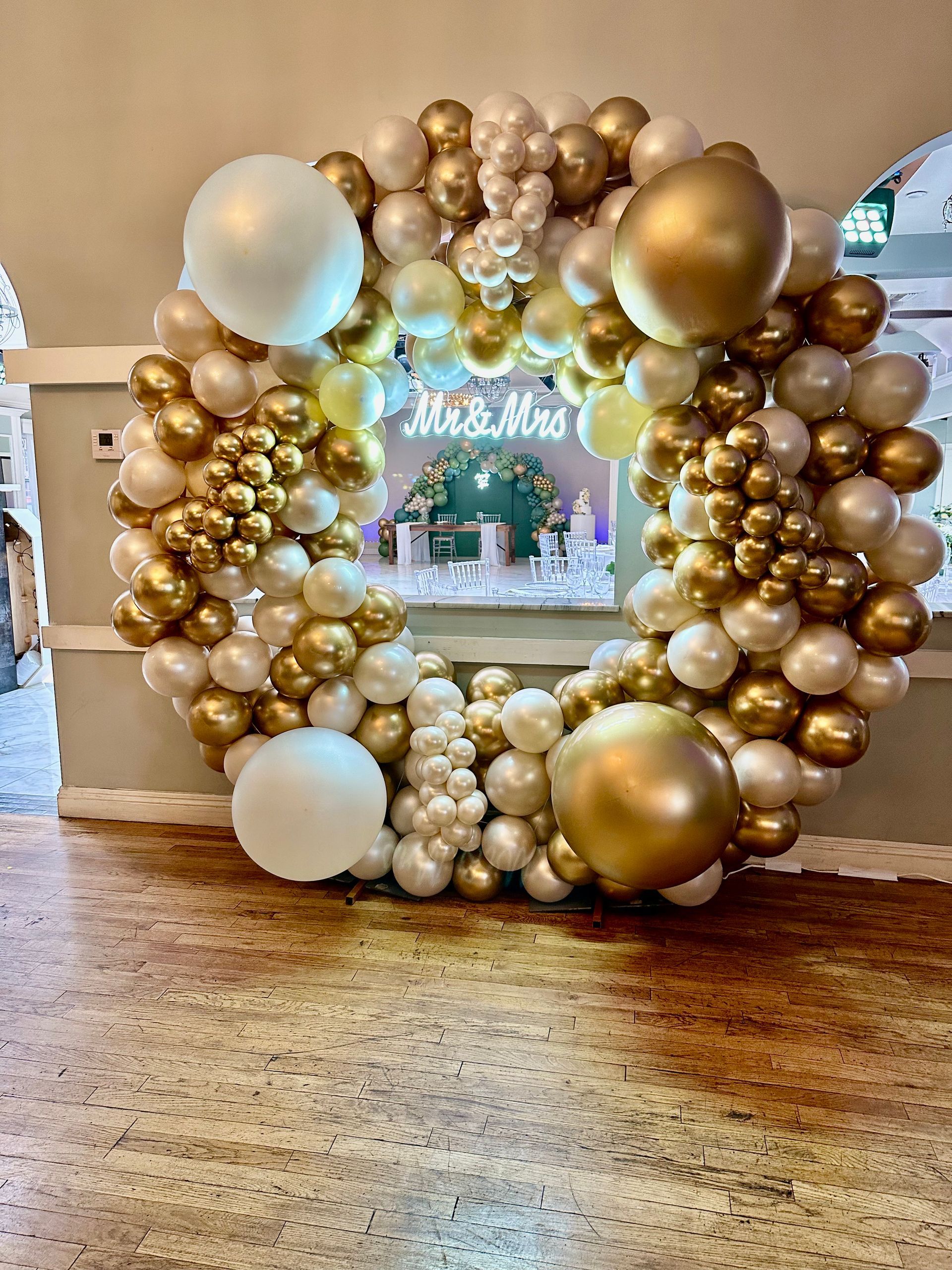 a bunch of balloons are sitting on the floor in a room