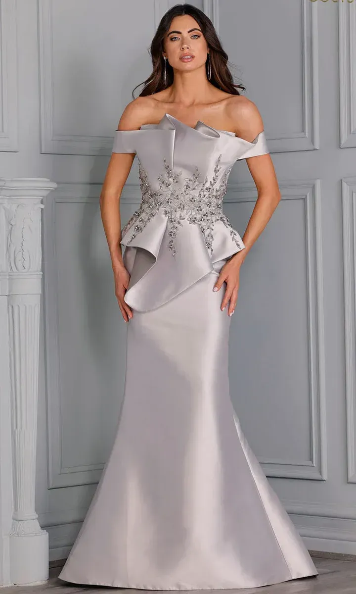A woman is wearing a gray off the shoulder dress.