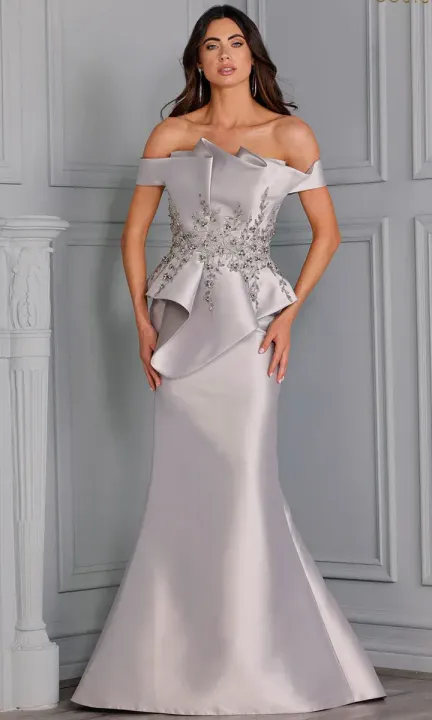 A woman is wearing a gray off the shoulder dress.