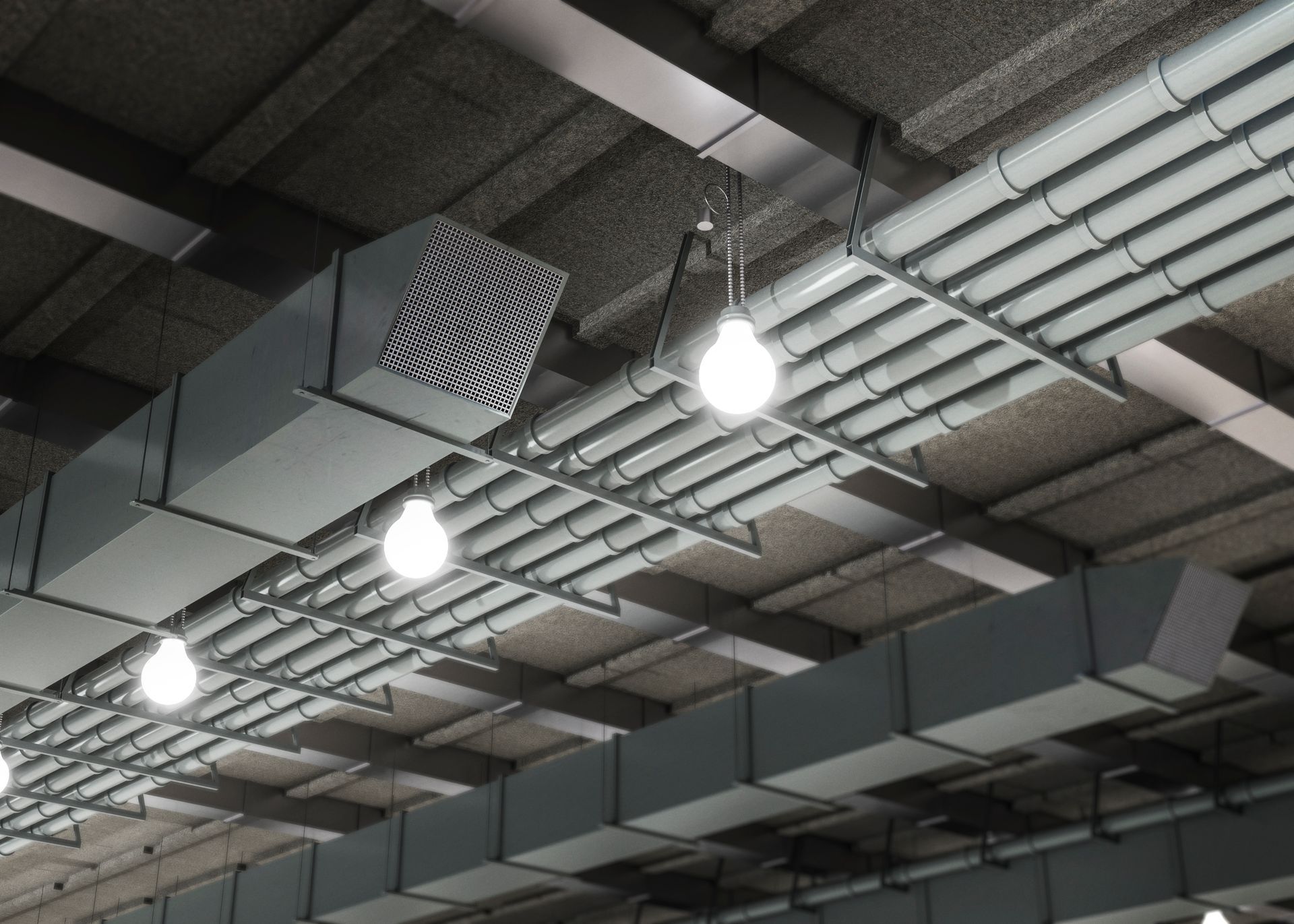 A ceiling with a lot of pipes and lights hanging from it