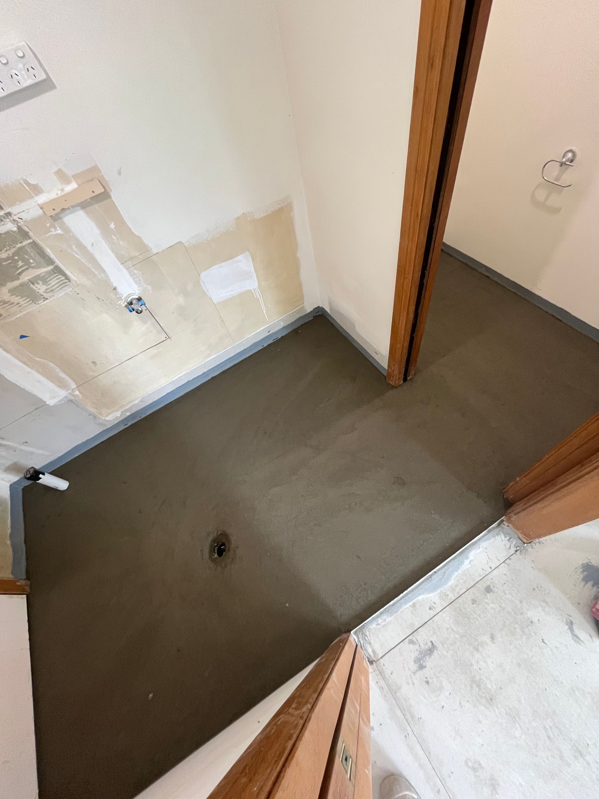 Bathroom Floor Under Construction, Dark Gray Concrete — Summerland Aquarium in Wollongbar, NSW