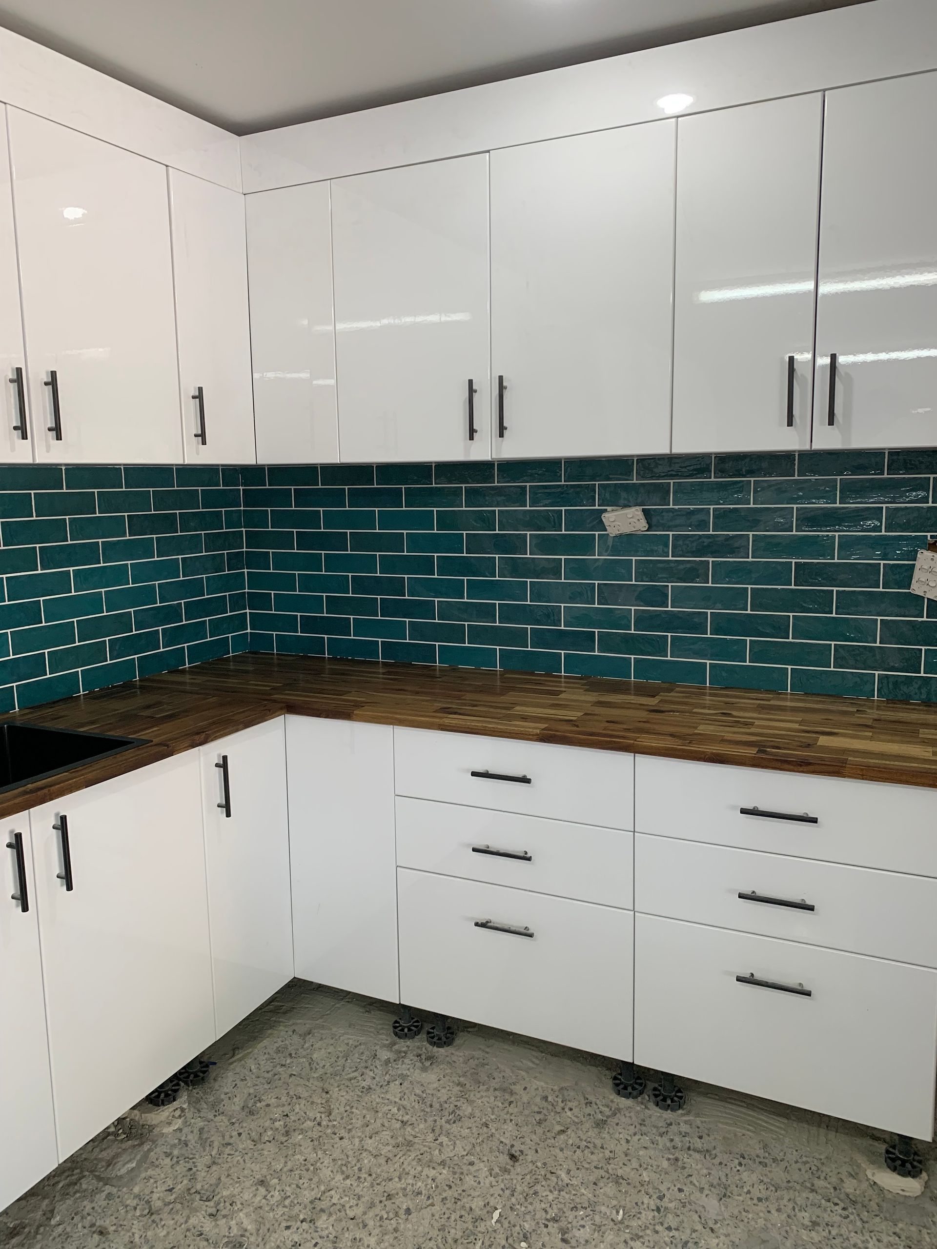 Kitchen with Cabinets, Green Tile Backsplash, and Brown Countertop — Summerland Aquarium in Wollongbar, NSW