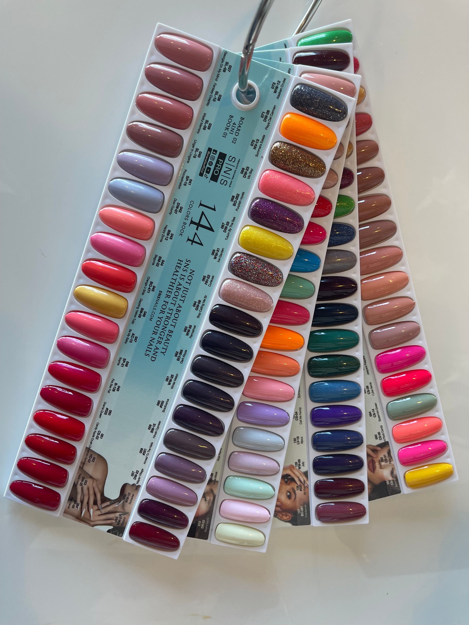 Nail polish color chart displaying various shades of red, pink, purple, and more.