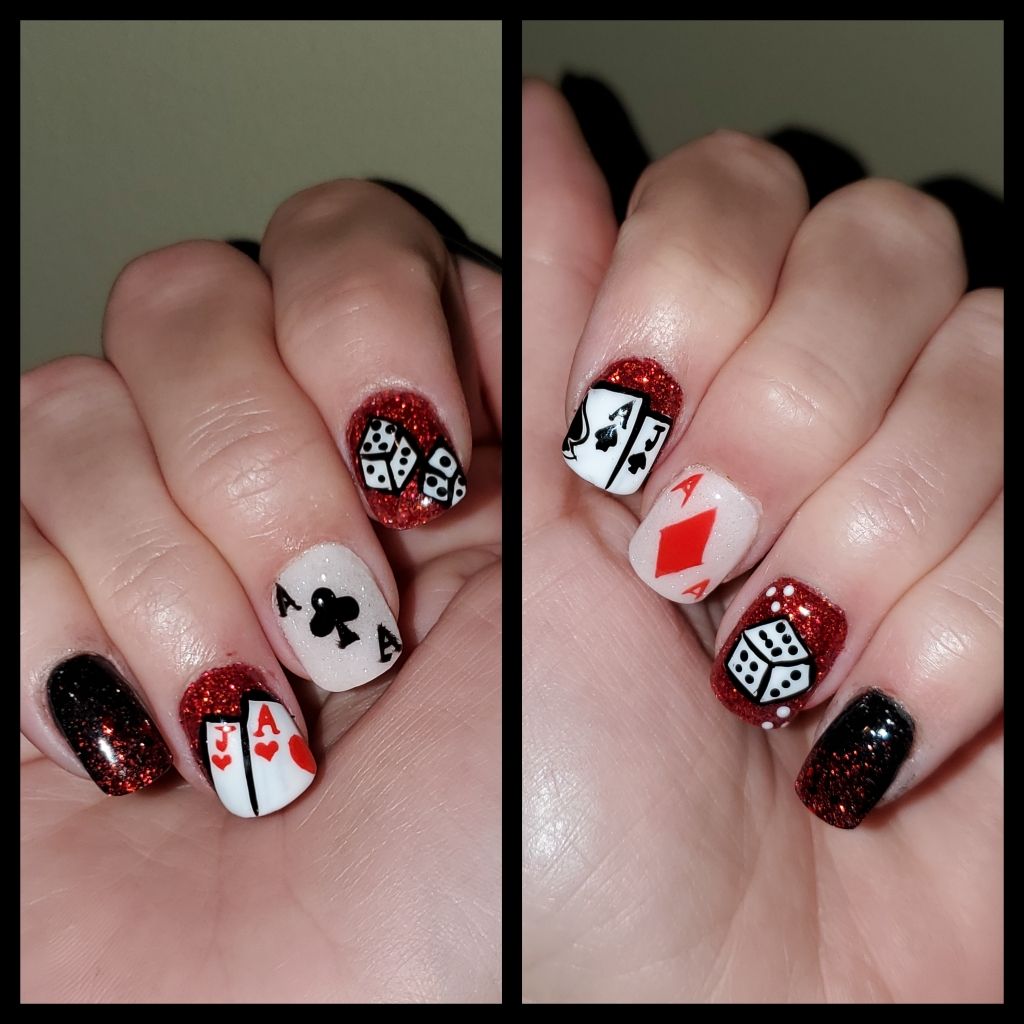 Hands with playing card and dice nail art on a white and red glitter background.