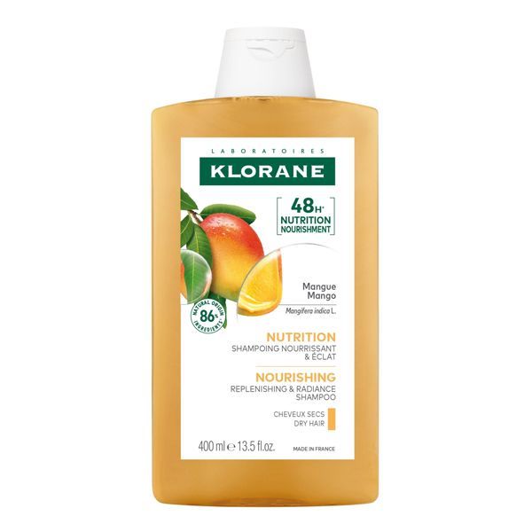 Una bottiglia di shampoo Klorane al mango e all'arancia.