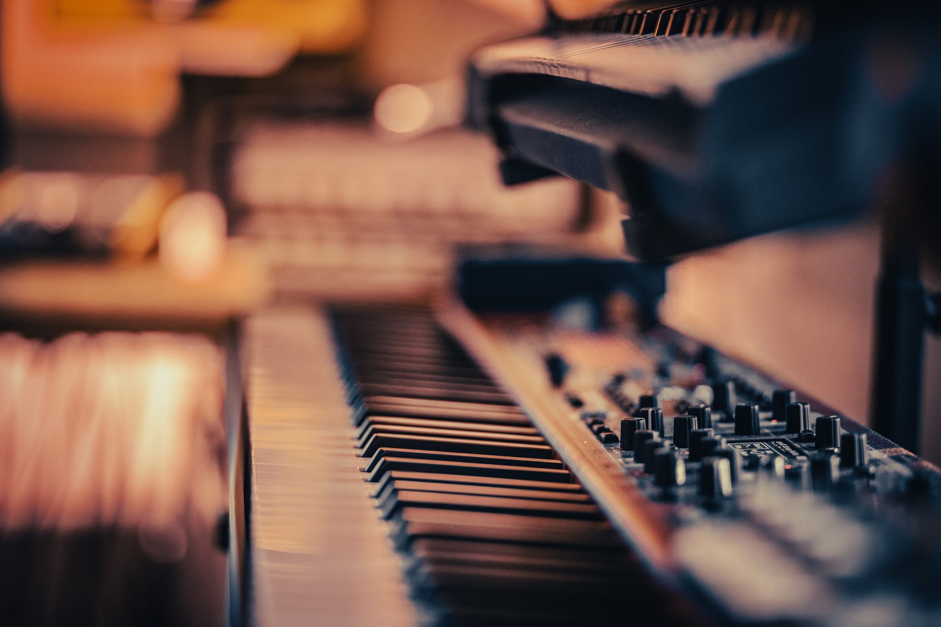a close up of a piano keyboard with a blurred background .