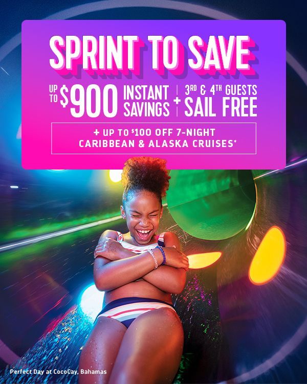 Three riders on horseback carrying American flags in an arena, illuminated by spotlights with birds flying overhead.