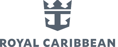 Three riders on horseback carrying American flags in an arena, illuminated by spotlights with birds flying overhead.