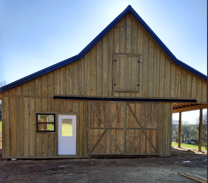 Custom wooden barn by Sands Fence Co.