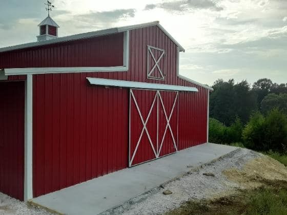Red custom barn by Sands Fence Co.