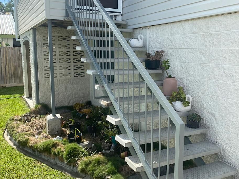 A Set Of Stairs Leading Up To The Side Of A House — Quality Fabrications & Welding Pty Ltd In Bohle, QLD