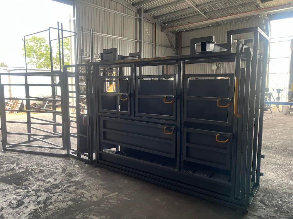 A Large Metal Structure Is Sitting Inside Of A Building — Quality Fabrications & Welding Pty Ltd In Bohle, QLD