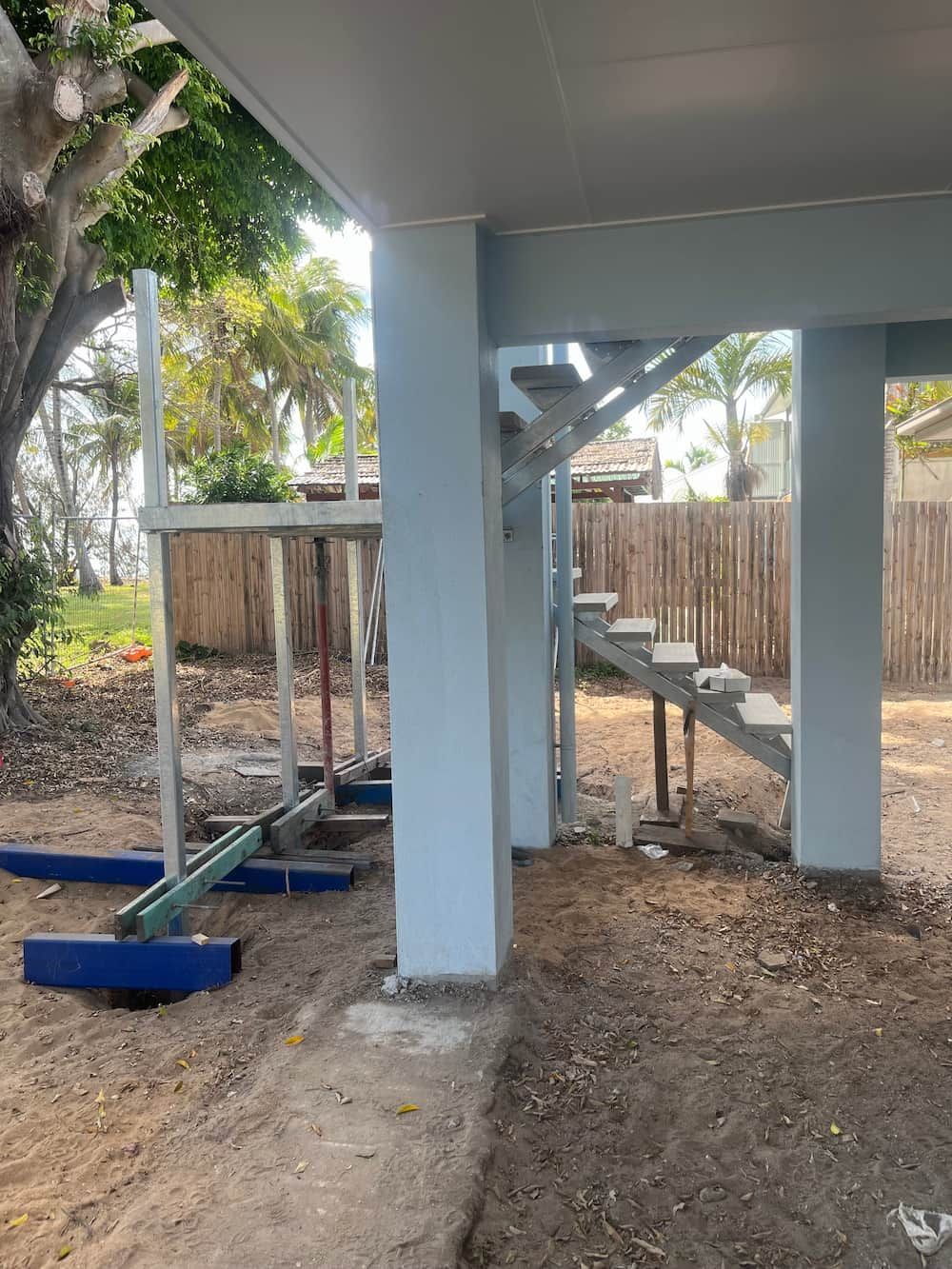 A Staircase Is Being Built Under A House — Quality Fabrications & Welding Pty Ltd In Bohle, QLD